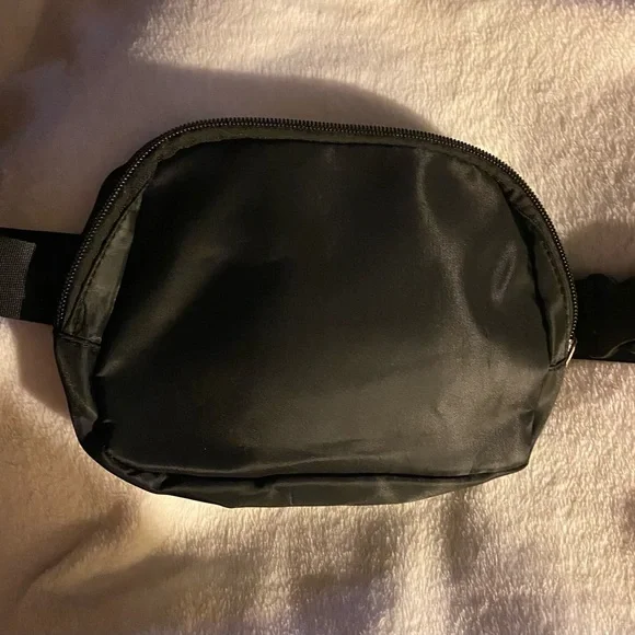 NWOT- Black waist belt bag. Fanny pack. Two zipper compartments.$5 or deal 2/$10 - Picture 3 of 4